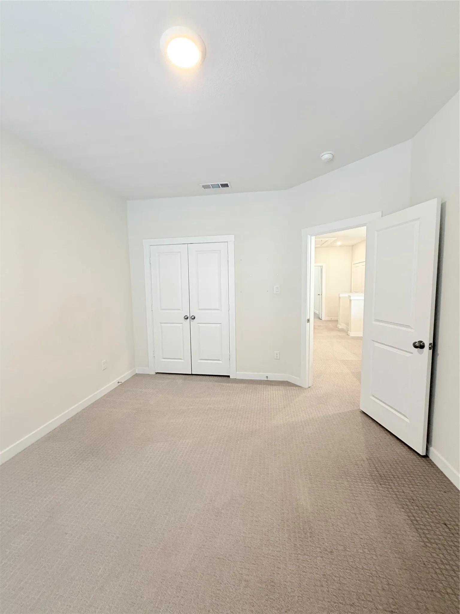 Room featuring neutral carpeting, light-toned walls, and recessed lighting