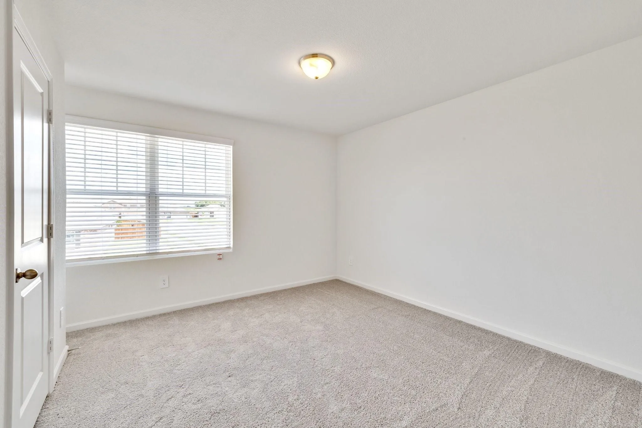 Room featuring neutral carpeting and white painted walls