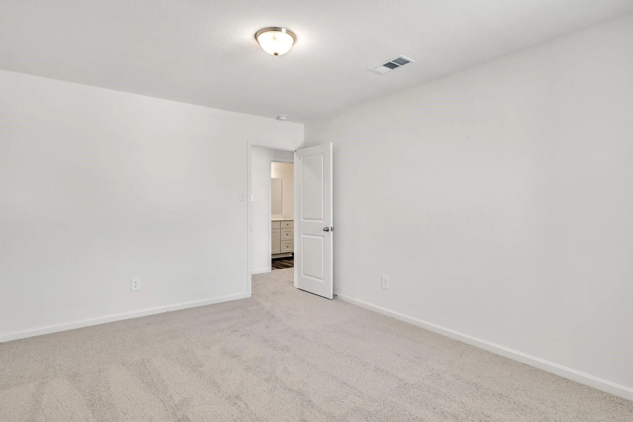 Wall-to-wall carpeting in a neutral tone