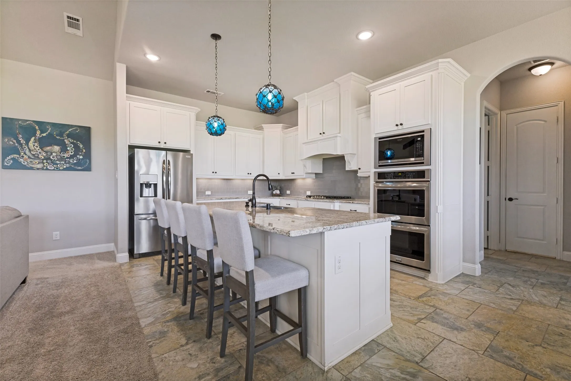 Gorgeous kitchen with all of the bells and whistles you could want!  So much prep space and the breakfast bar OMG!