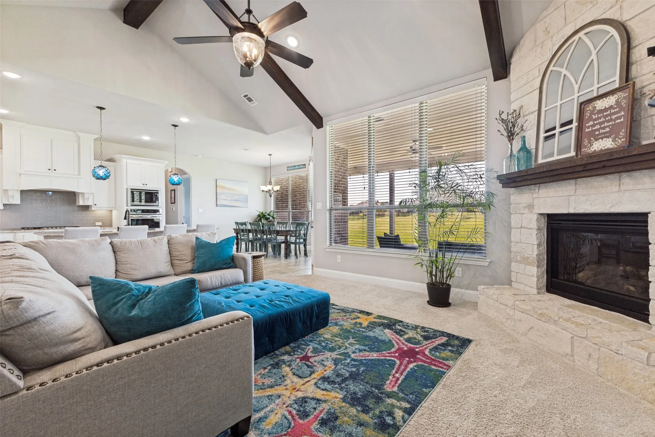 Living area open to kitchen AND dining while overlooking the unbelievable back yard!