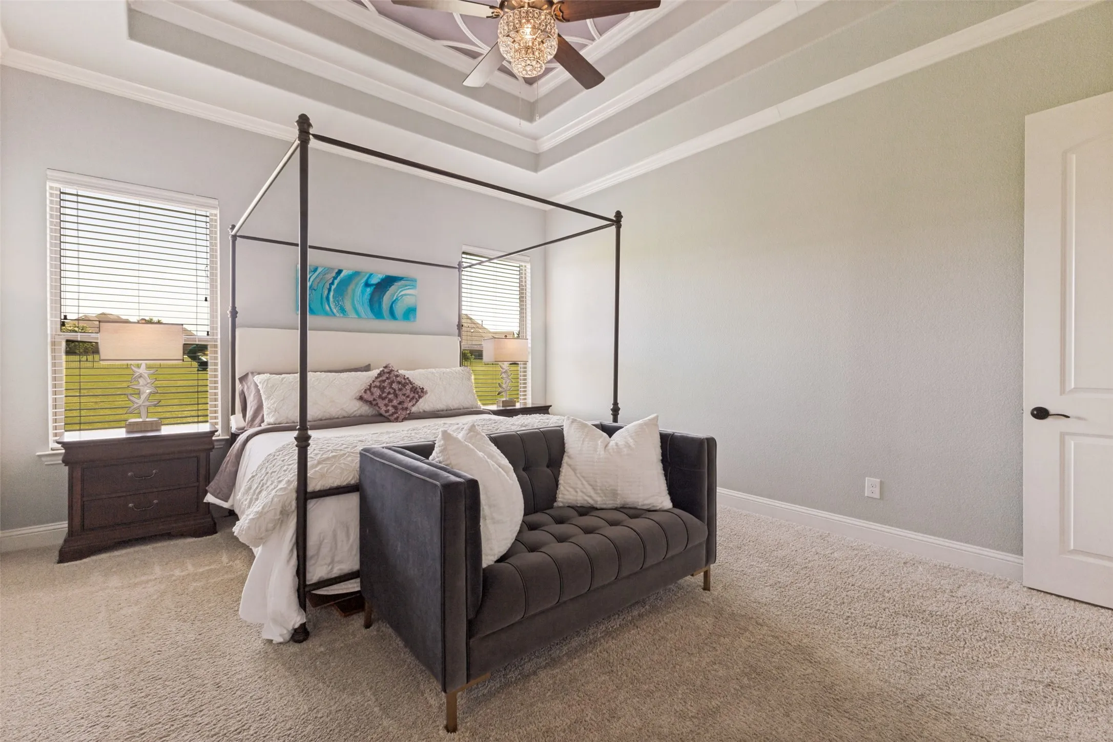Primary Bedroom with huge windows overlooking gorgeous back yard.