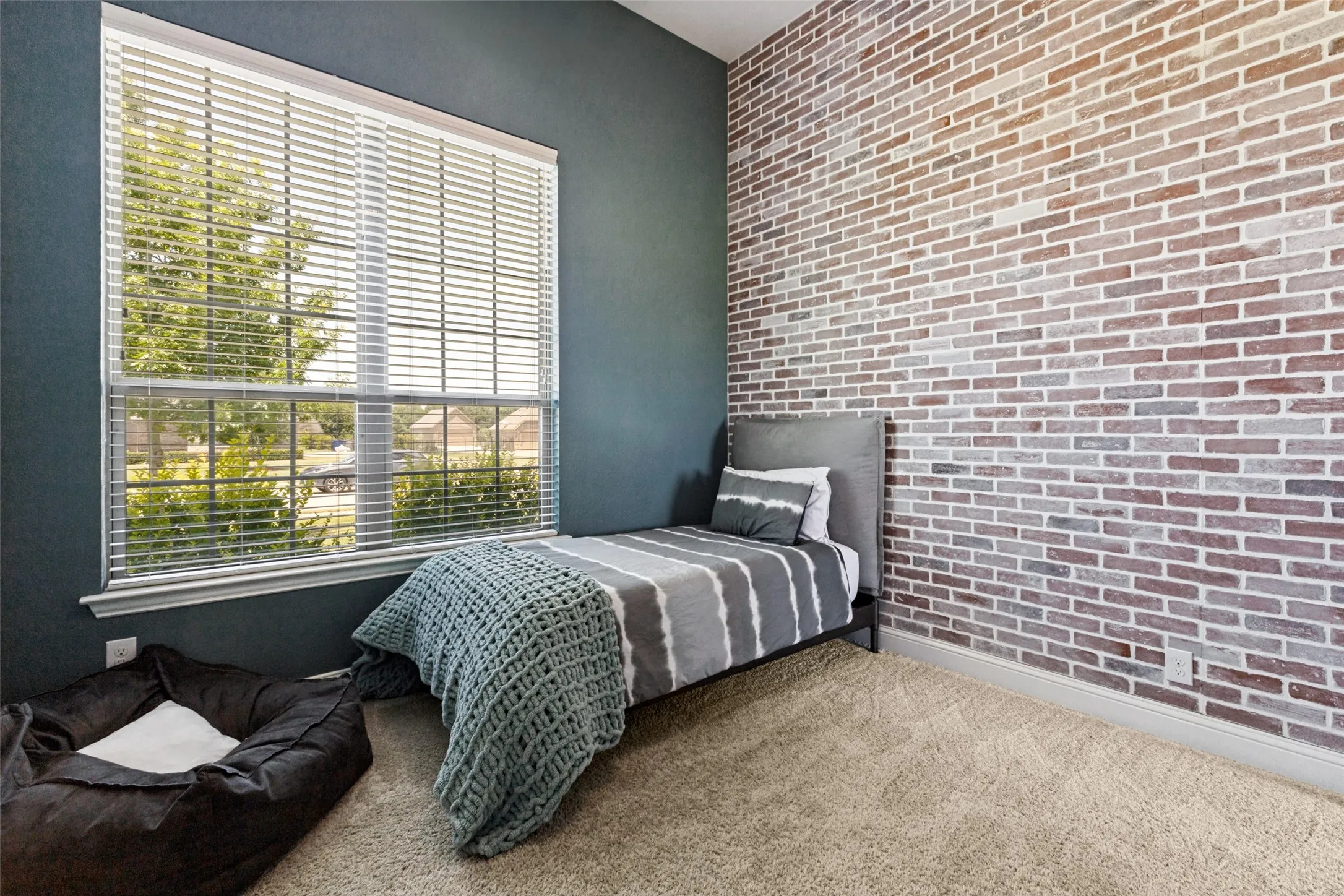 Another beautiful bedroom with a designer's touch on one wall!