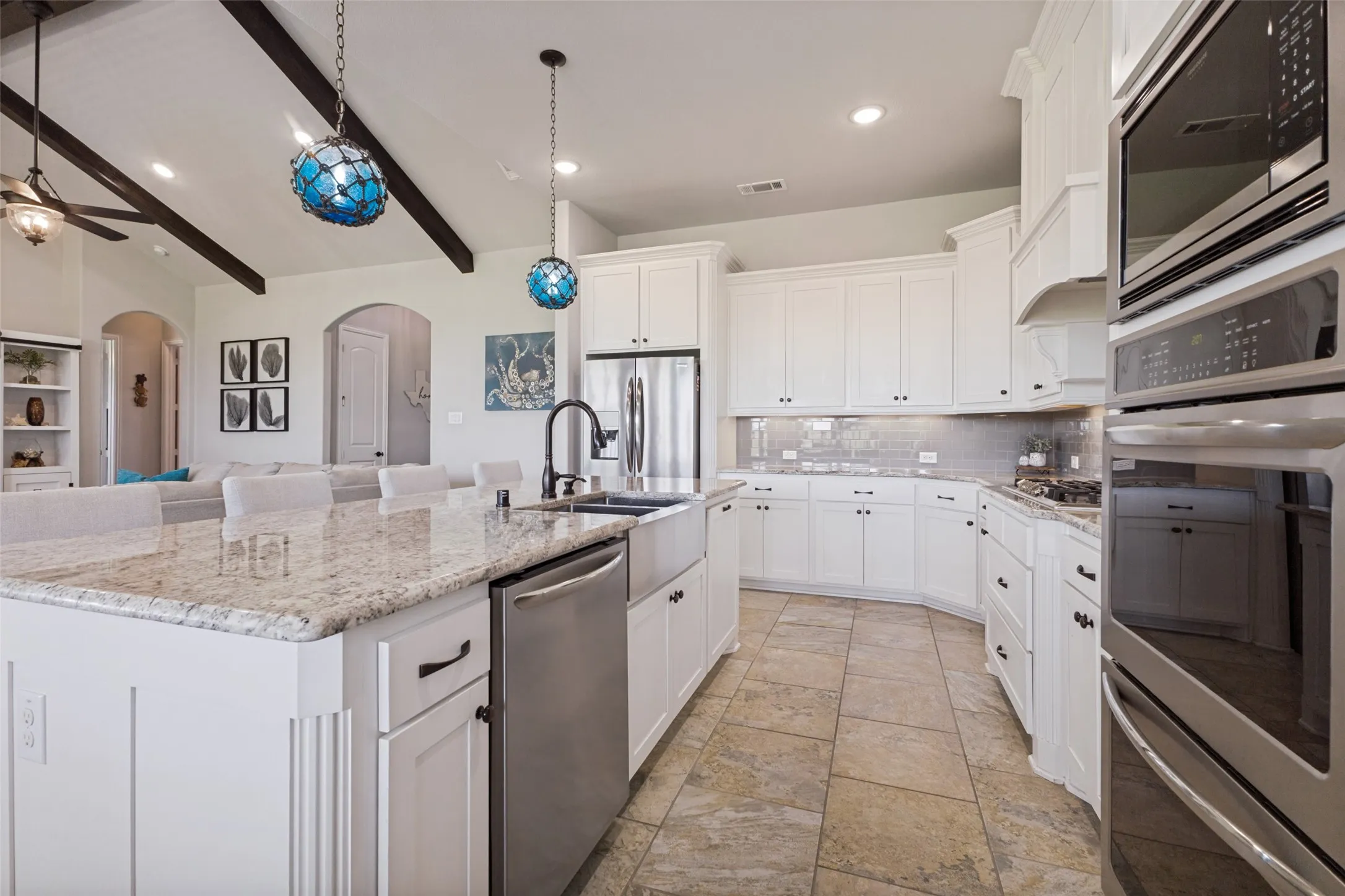 Pristine granite counter tops and gorgeous tile floors.