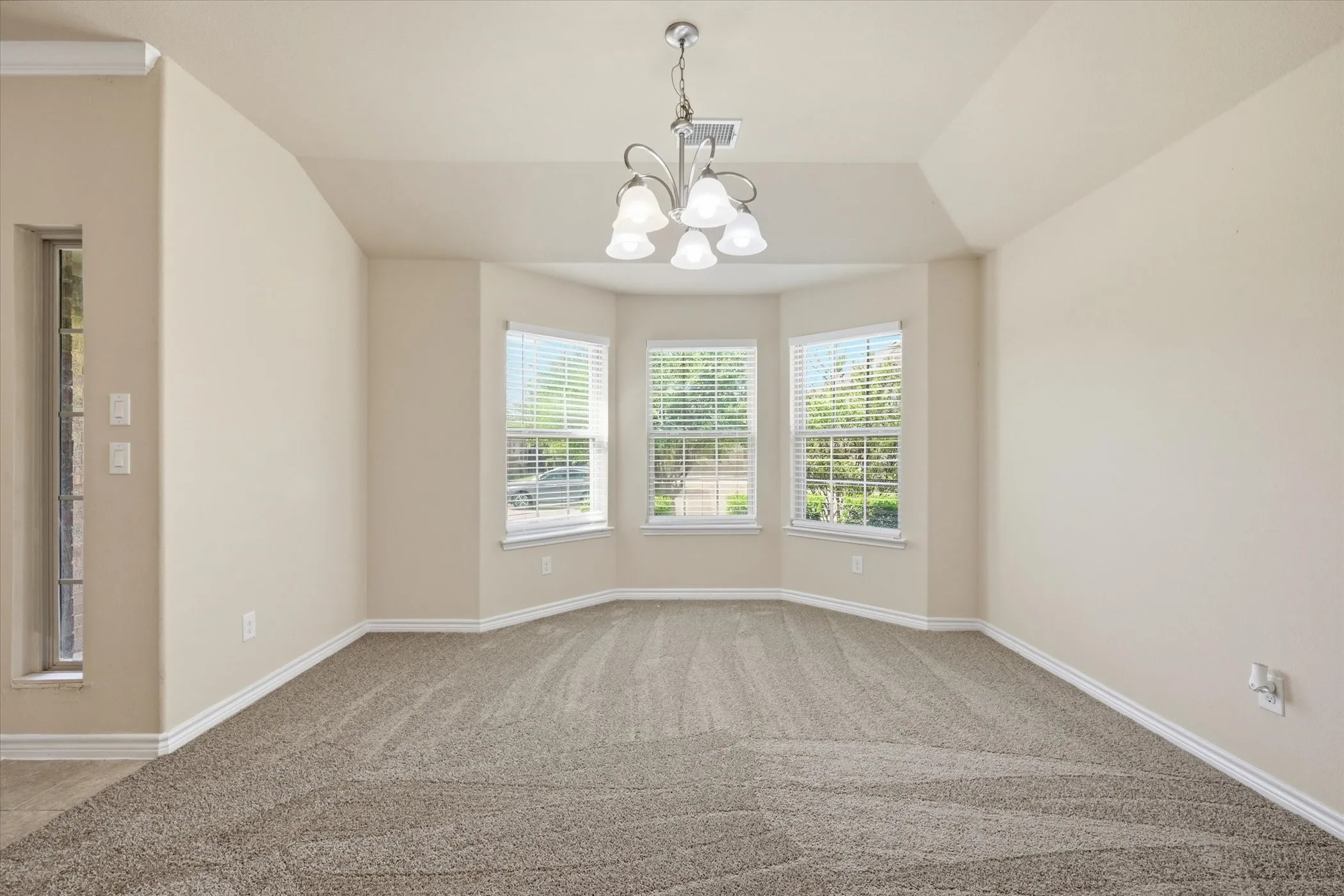 Recessed ceiling detail over a bay window with three panel windows
