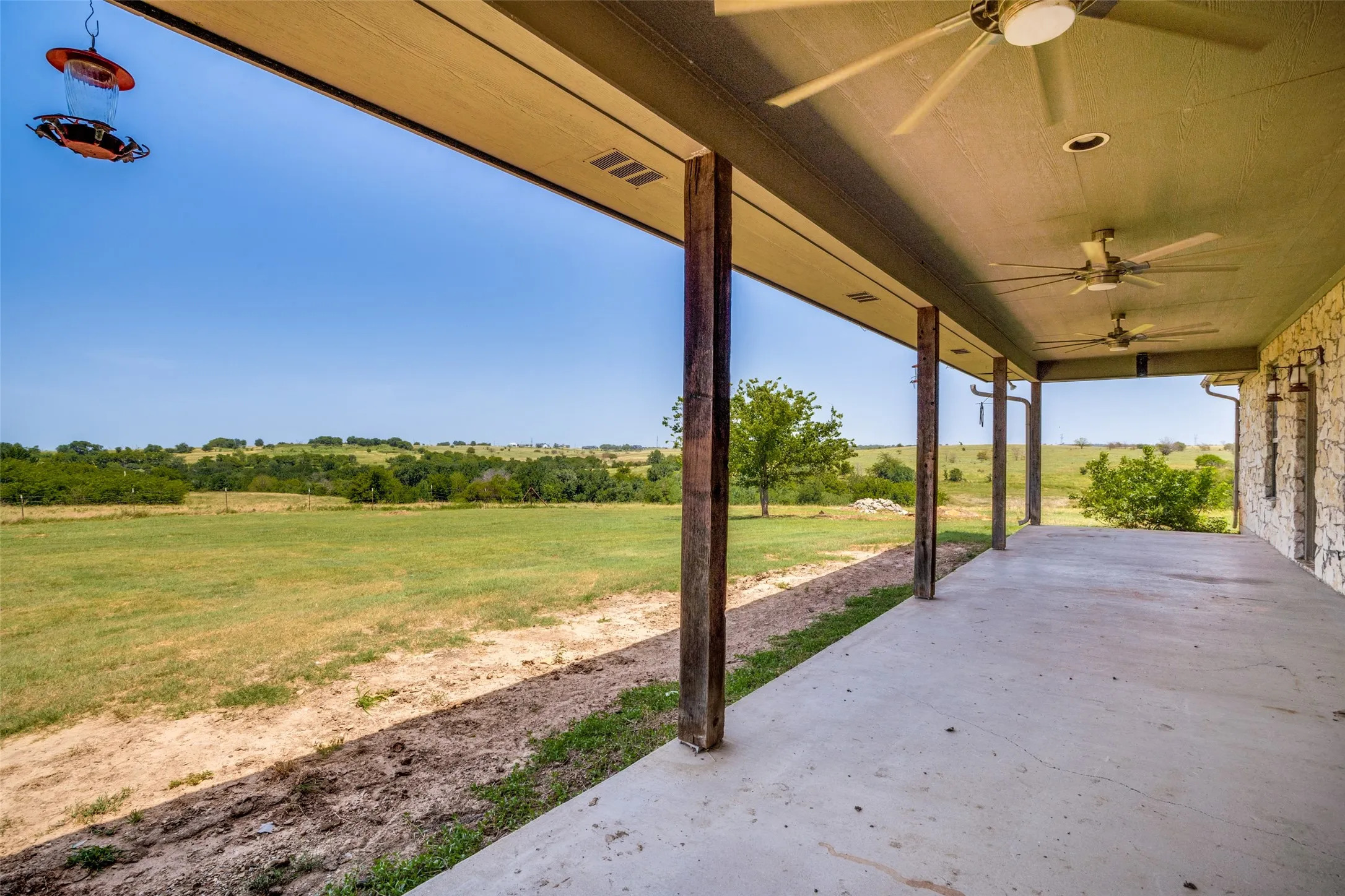 Expansive covered patio with concrete flooring