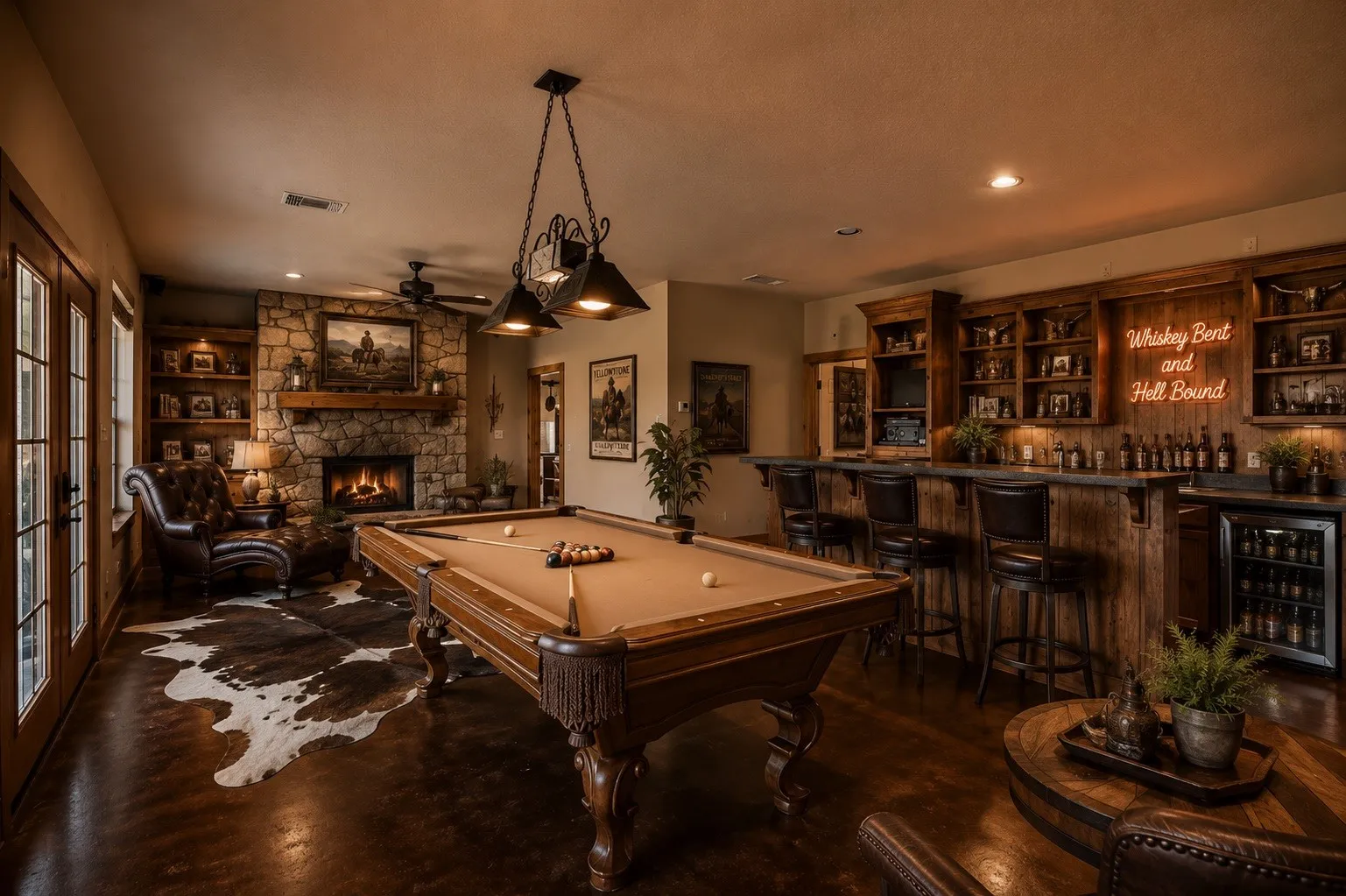 Recreation room featuring a detailed wood pool table, stone fireplace with wood mantel, built-in shelving, a full wet bar with dark wood cabinetry and bar seating, and French doors