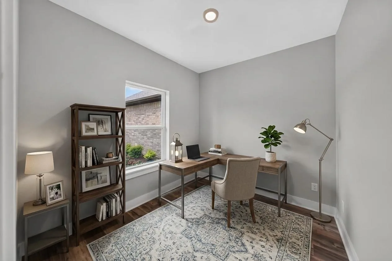 Versatile room featuring a window with natural light, a built-in ceiling light fixture, wood-finish flooring, and light-toned wall paint. Virtually staged.