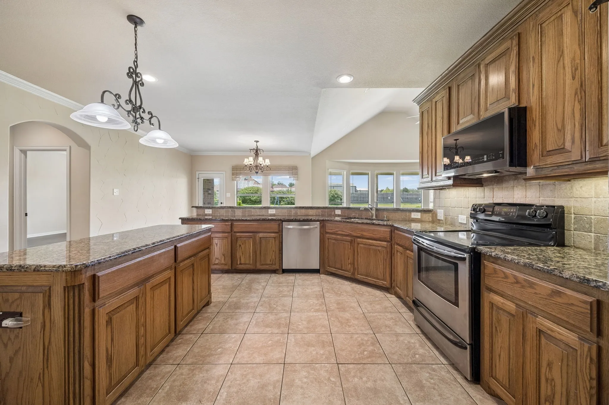 This kitchen has so much to offer! Massive amounts of cabinet and counter space.