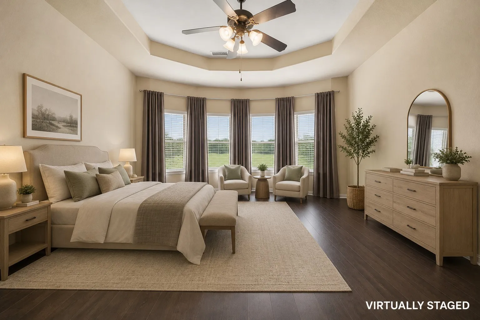 This owner's suite feels so luxurious with those stunning windows and tray ceiling.