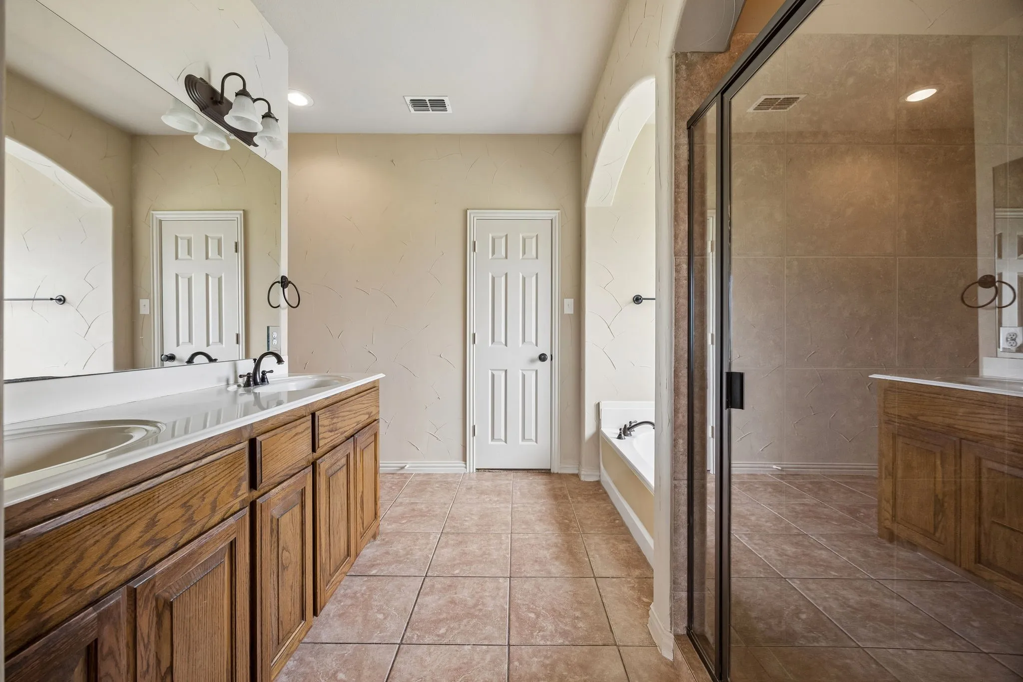 Dual sinks. Large tub. Separate shower.