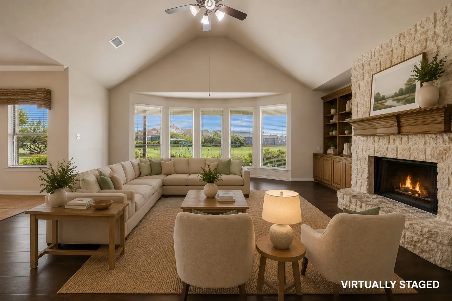 The living room with the floor to ceiling wood burning fireplace is spacious and stunning.