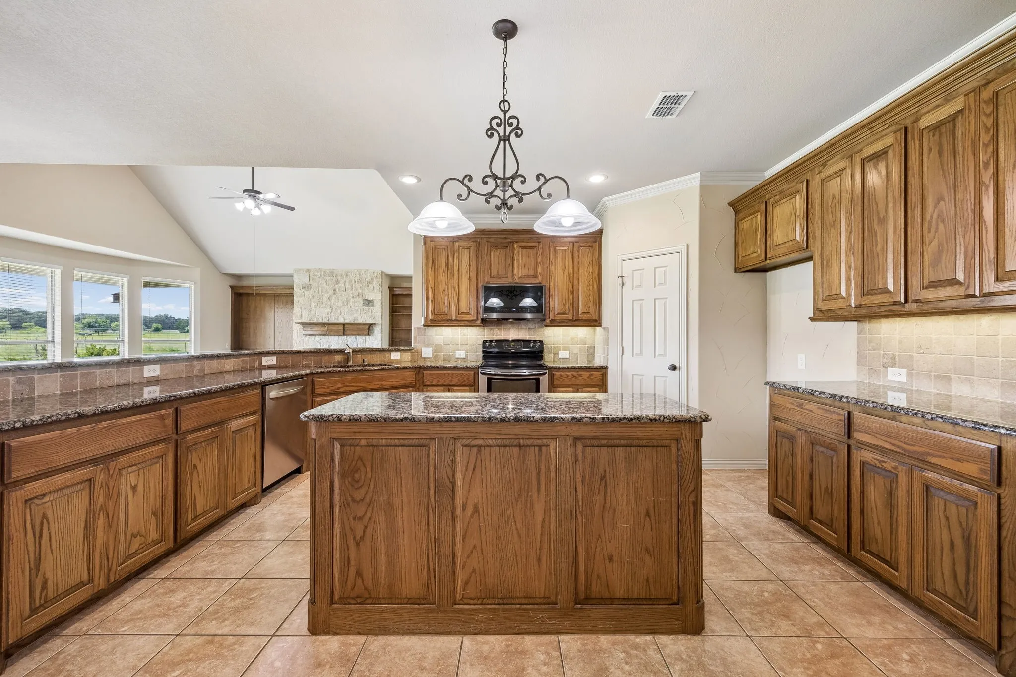 This kitchen has so much to offer! Massive amounts of cabinet and counter space.