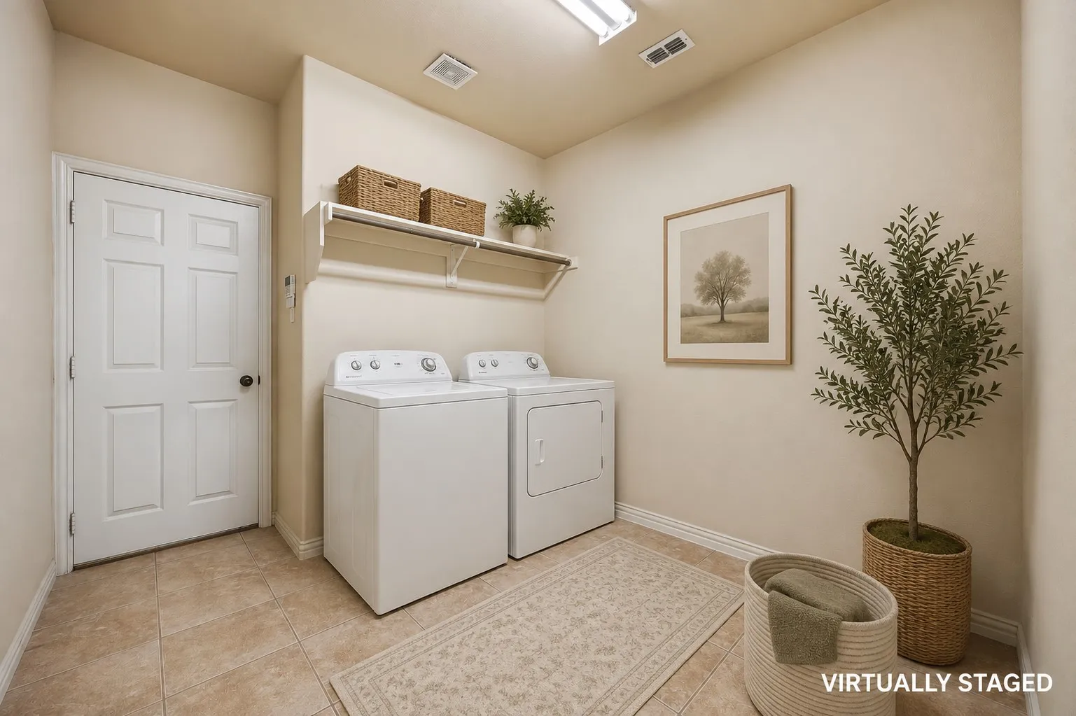 Super spacious laundry that leads to garage.