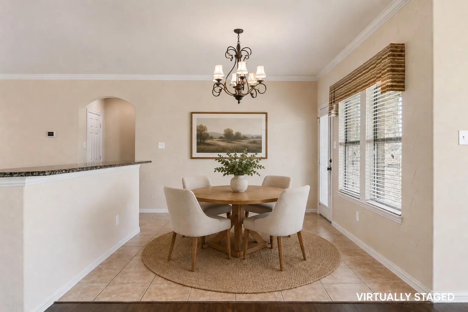 This breakfast room is open to the kitchen and family room.