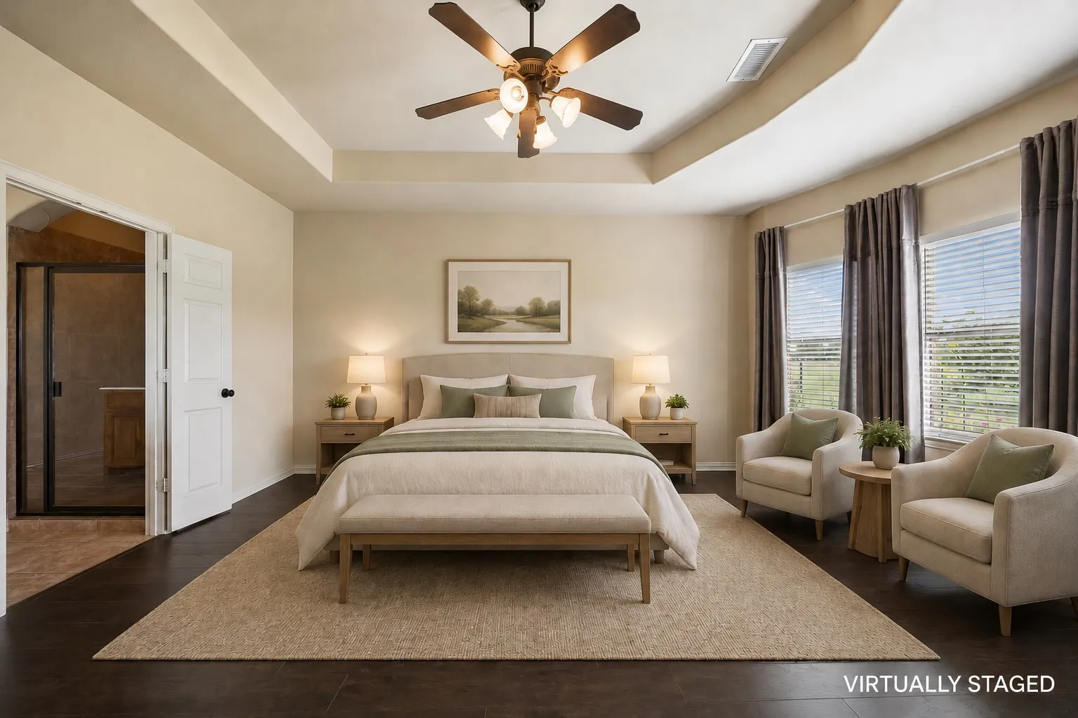 This owner's suite feels so luxurious with those stunning windows and tray ceiling.
