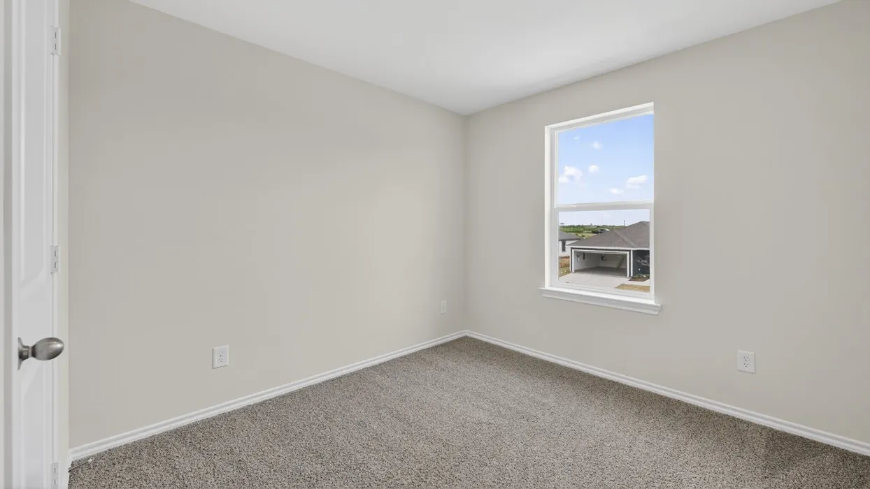 Neutral-toned interior room with light gray walls and plush gray carpeting