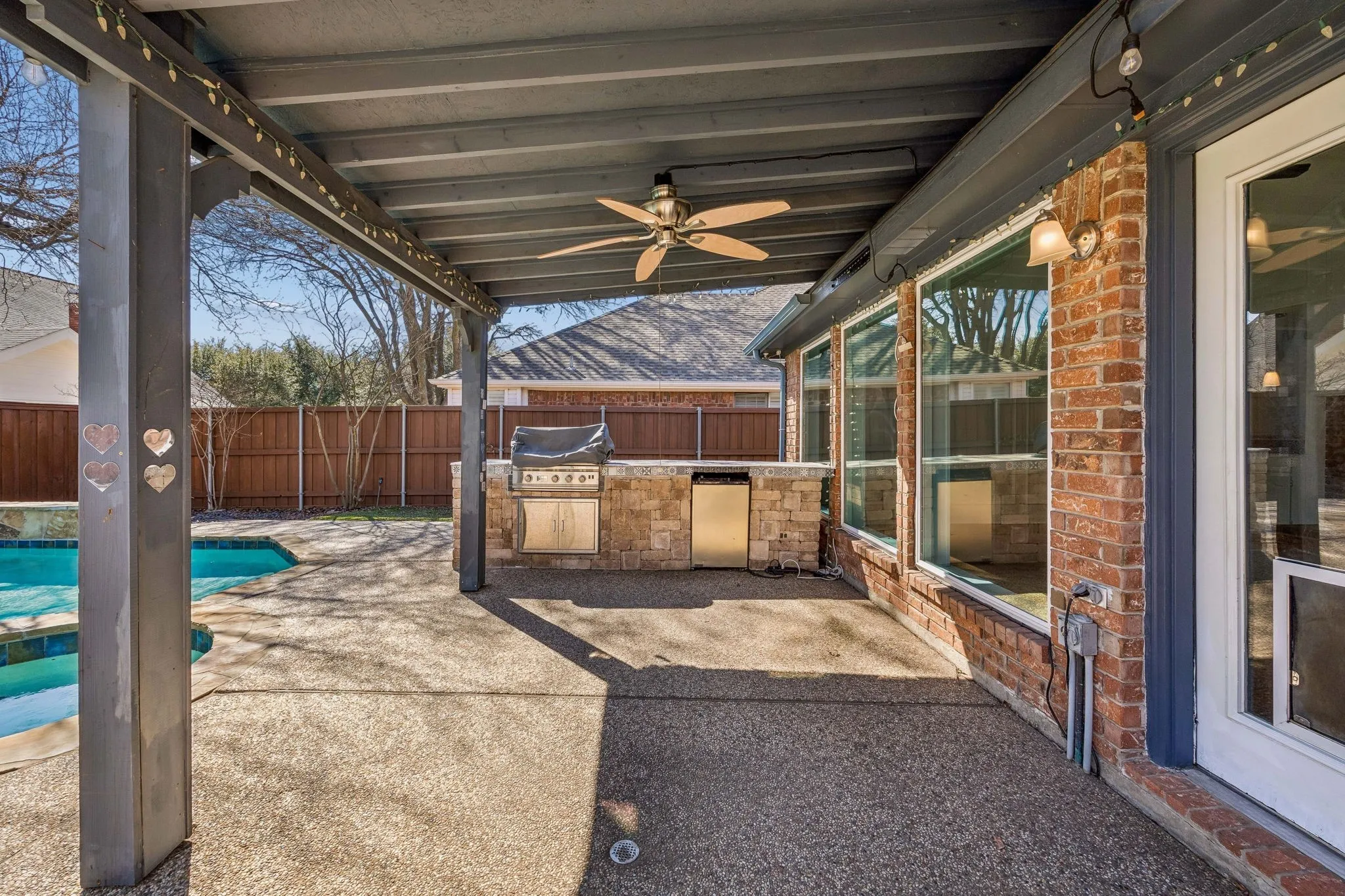 This covered patio is perfect for Sunday game watching, or evening dining. Grill has been recently updated.