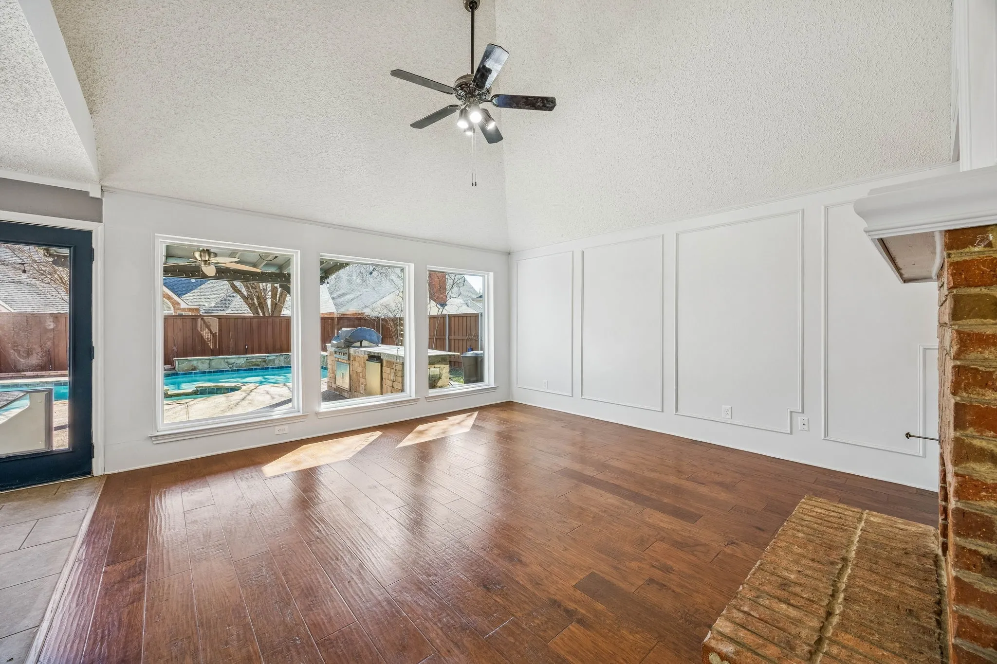 Family room is so inviting and light with its new picture windows.
