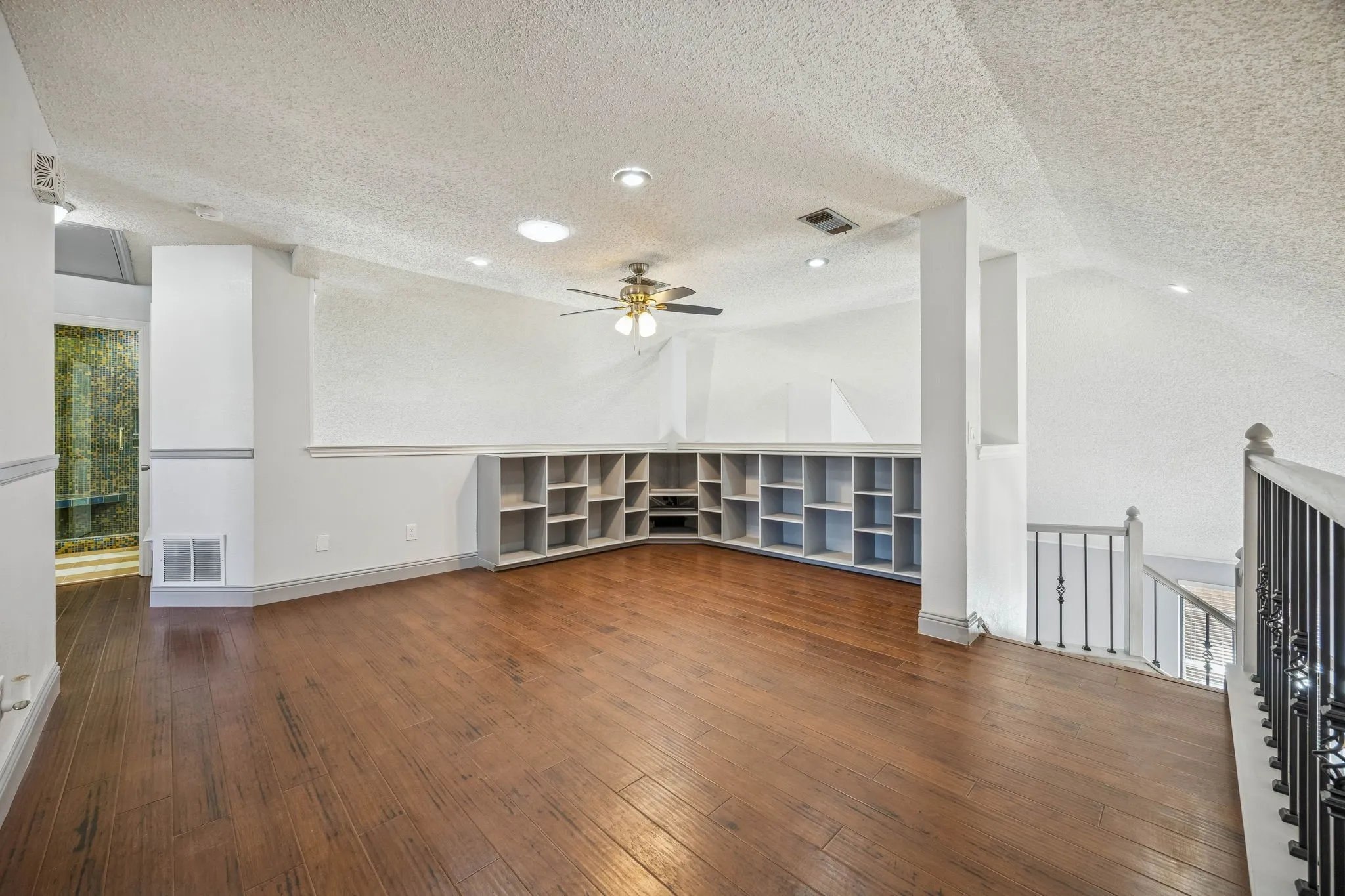At the top of the stairs, sits this gameroom/loft area with cute bookcases and plenty of room entertaining.