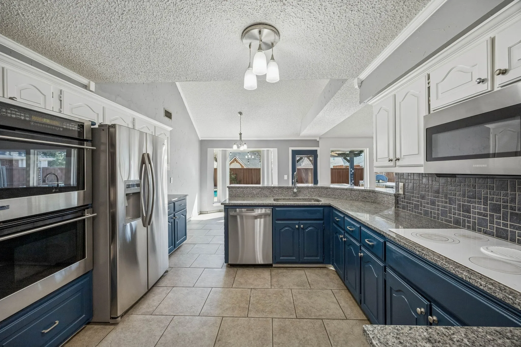 Kitchen has new ovens, dishwasher, microwave and includes the LG refrigerator.