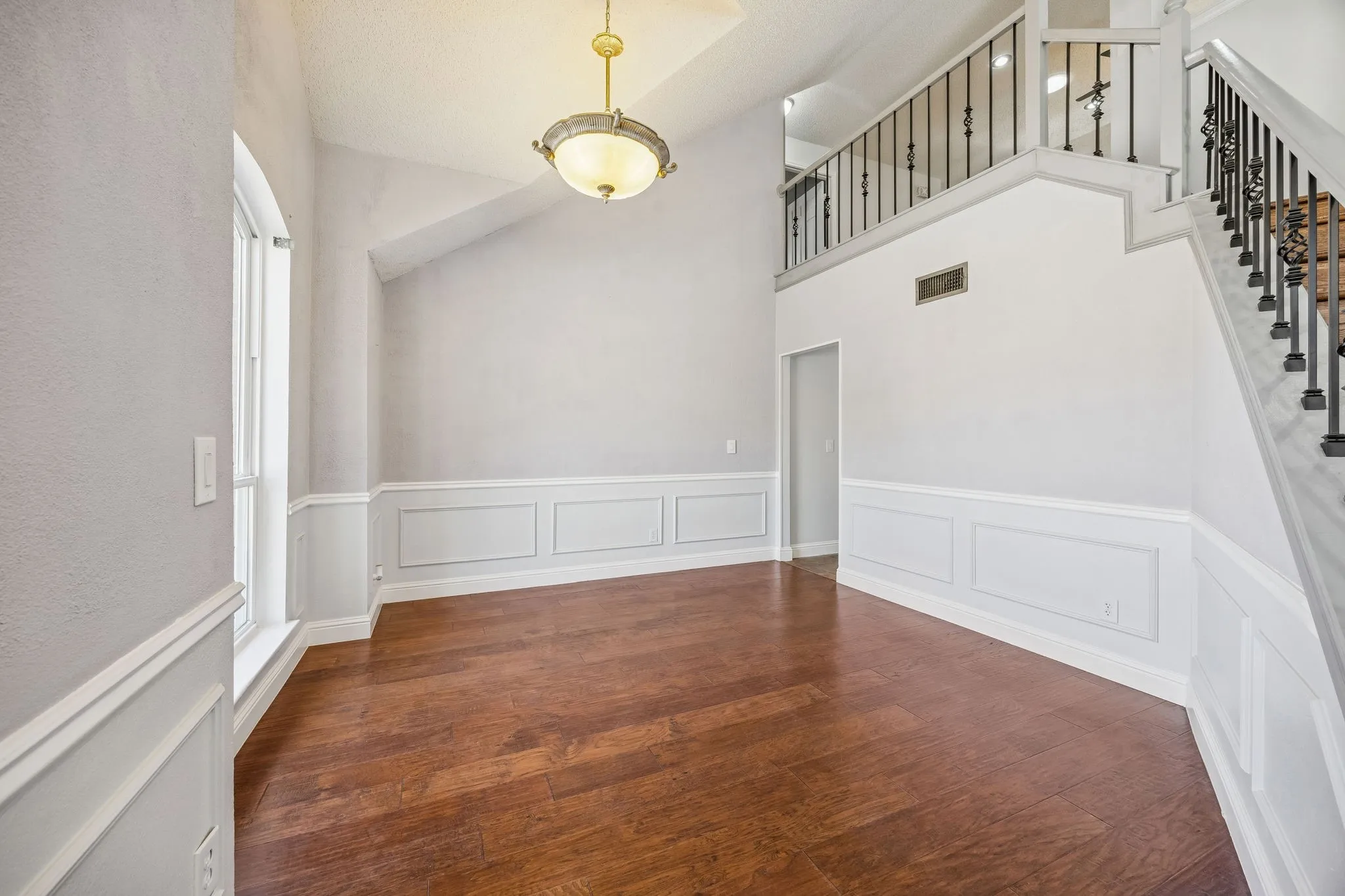 We see this space as a potential lounge, home office, or formal dining room.