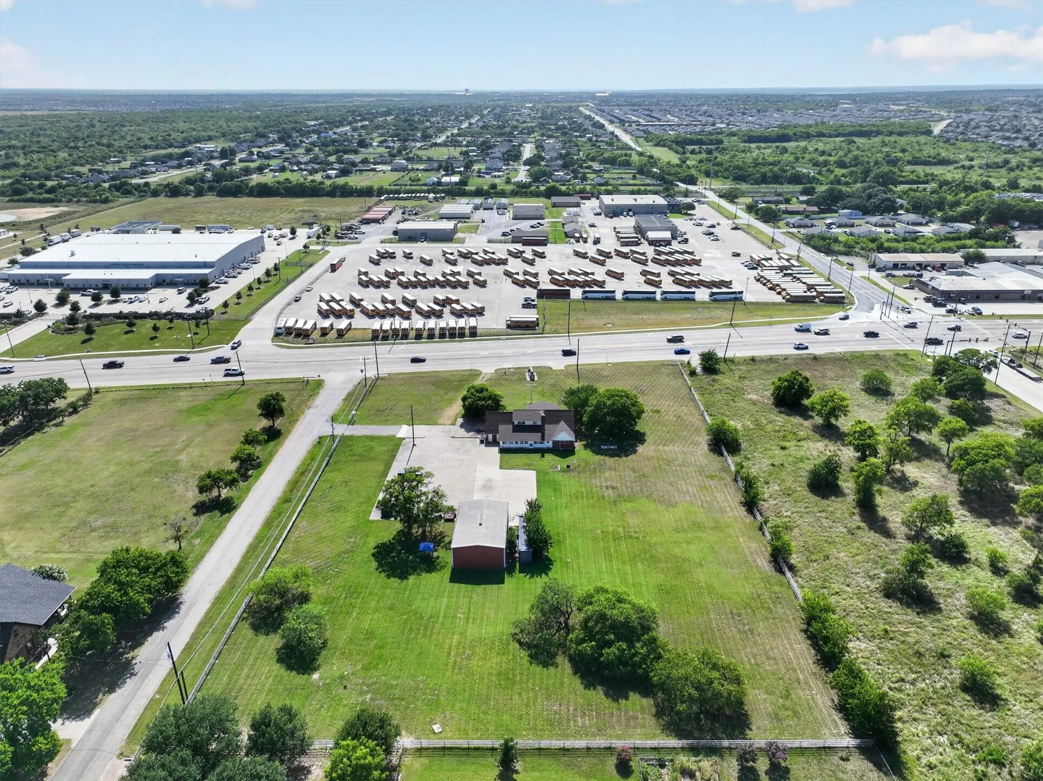 Expansive property featuring a single-story residence and detached outbuilding on a generous lot