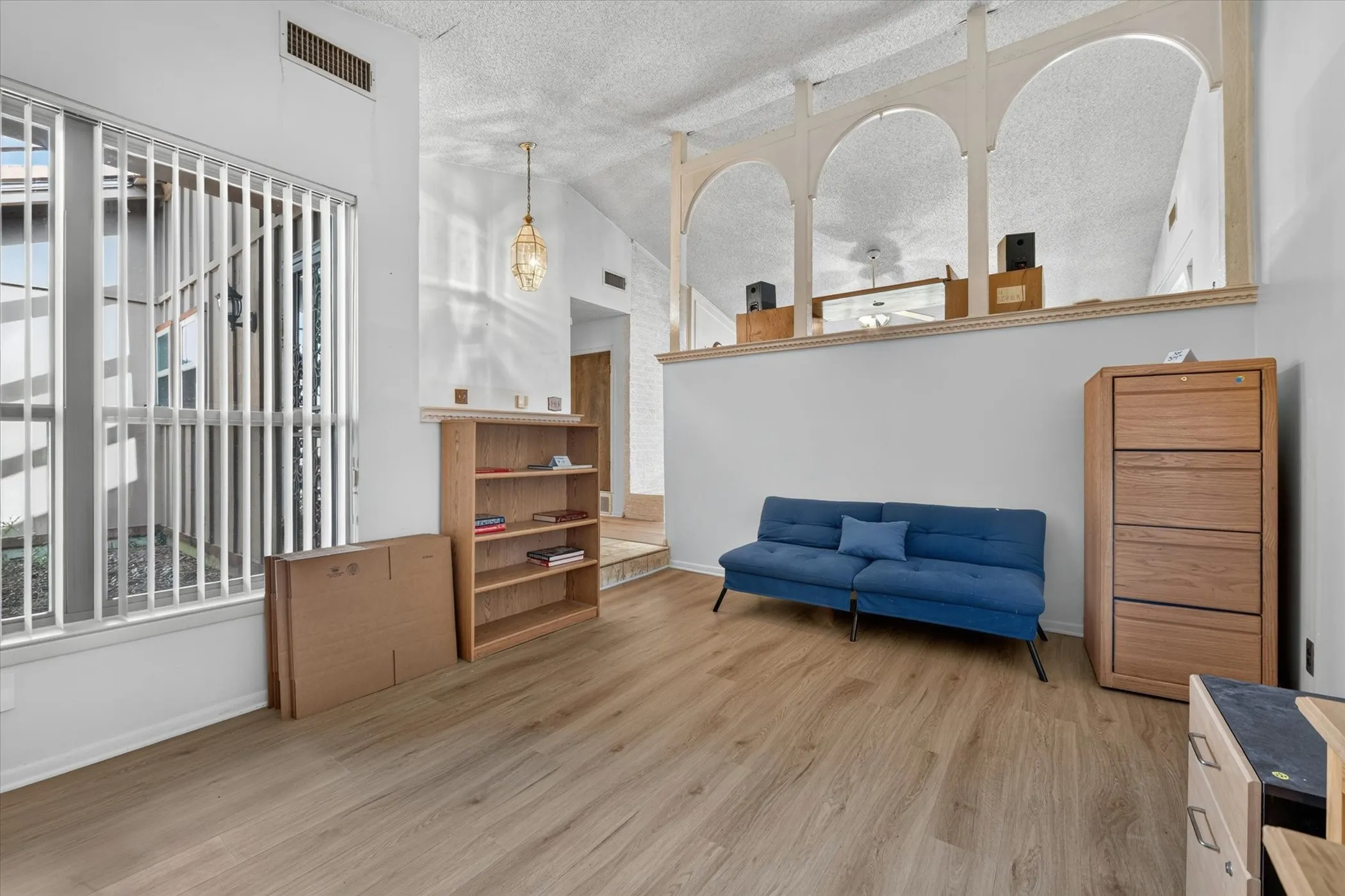 Vaulted ceiling with an architectural arched half-wall detail
