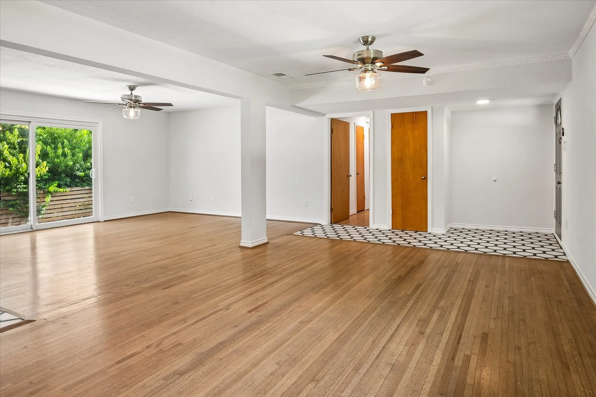 View from Living/dining area towards entry, family room and hallway to bedrooms. There is a front coat closet and hall closets for extra storage.