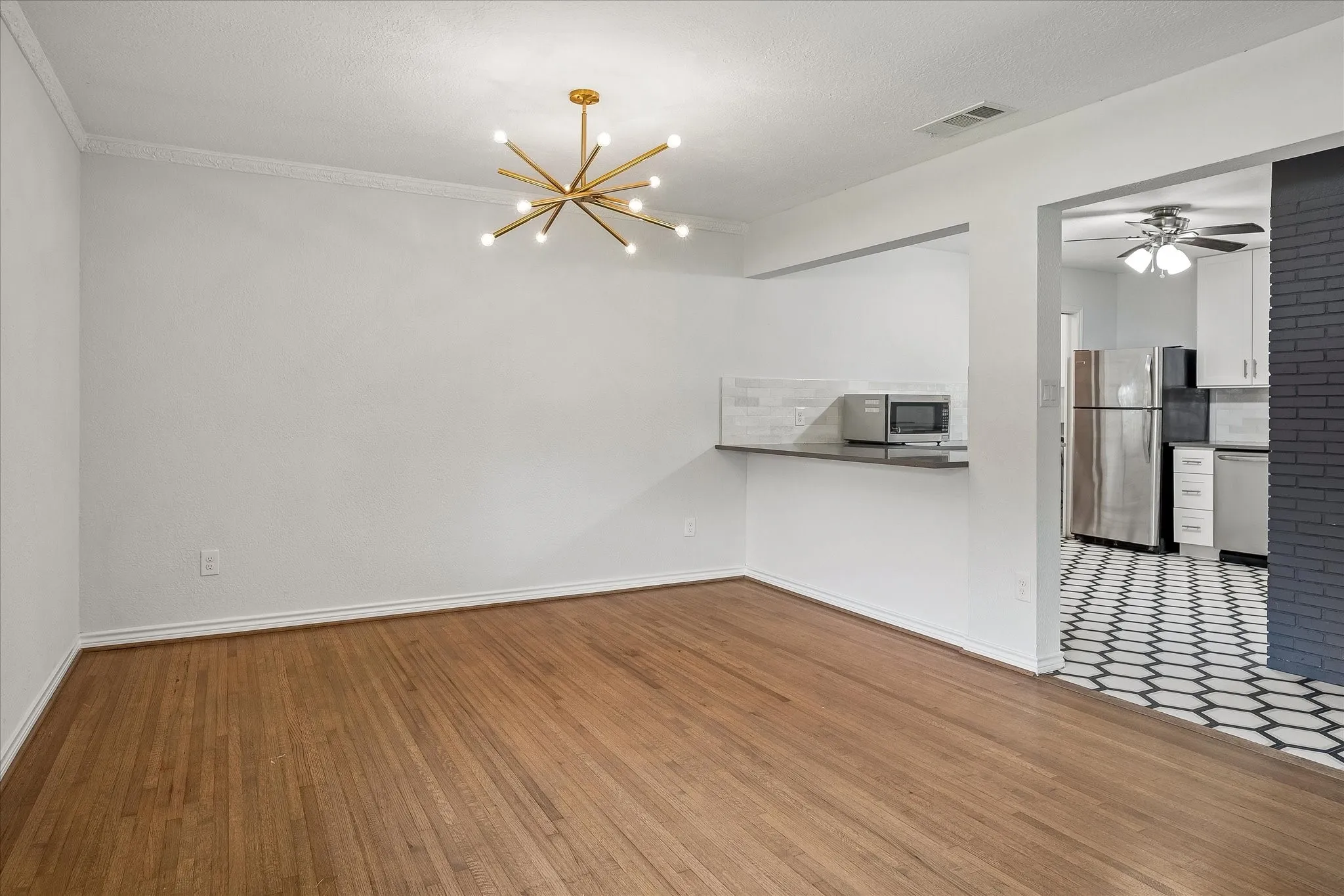 Dining area is spacious and has a bar area to accomodate bar stools for casual dining and serving as well.