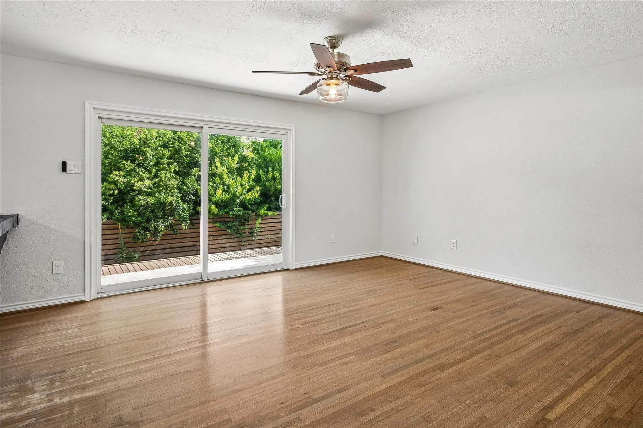 Peaceful family room with sliding doors opening to the huge patio/deck and expansive back yard. No views of neighbors which provides for exceptional privacy.