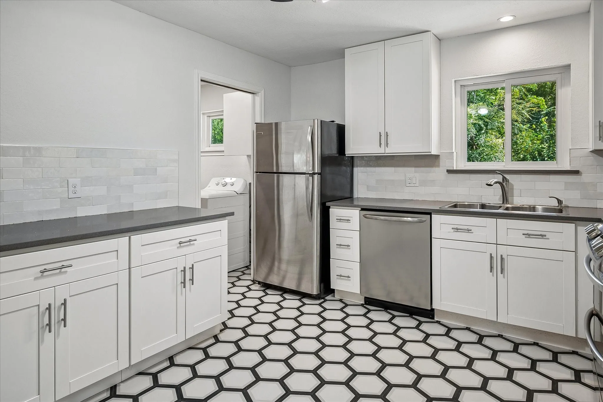 Spacious kitchen with ample cabinet and countertop space and a great layout for cooking and gathering.