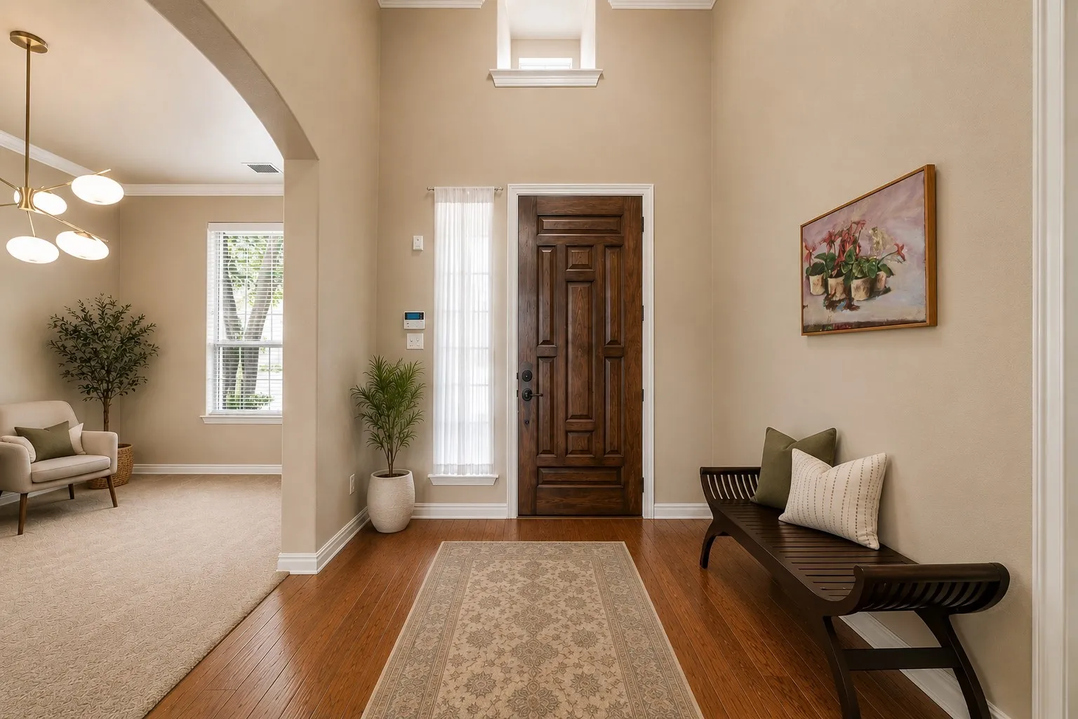 Two-story foyer with rich wood-finish flooring, a paneled entry door, and an arched doorway leading to a carpeted room