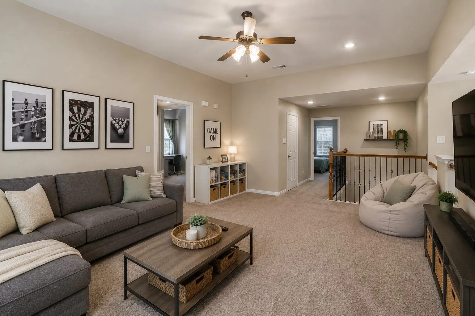 Carpeted living area with sloped ceilings and recessed lighting