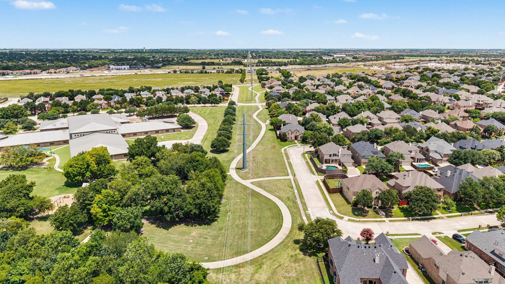Expansive residential area featuring numerous single-family homes with diverse architectural styles and mature trees