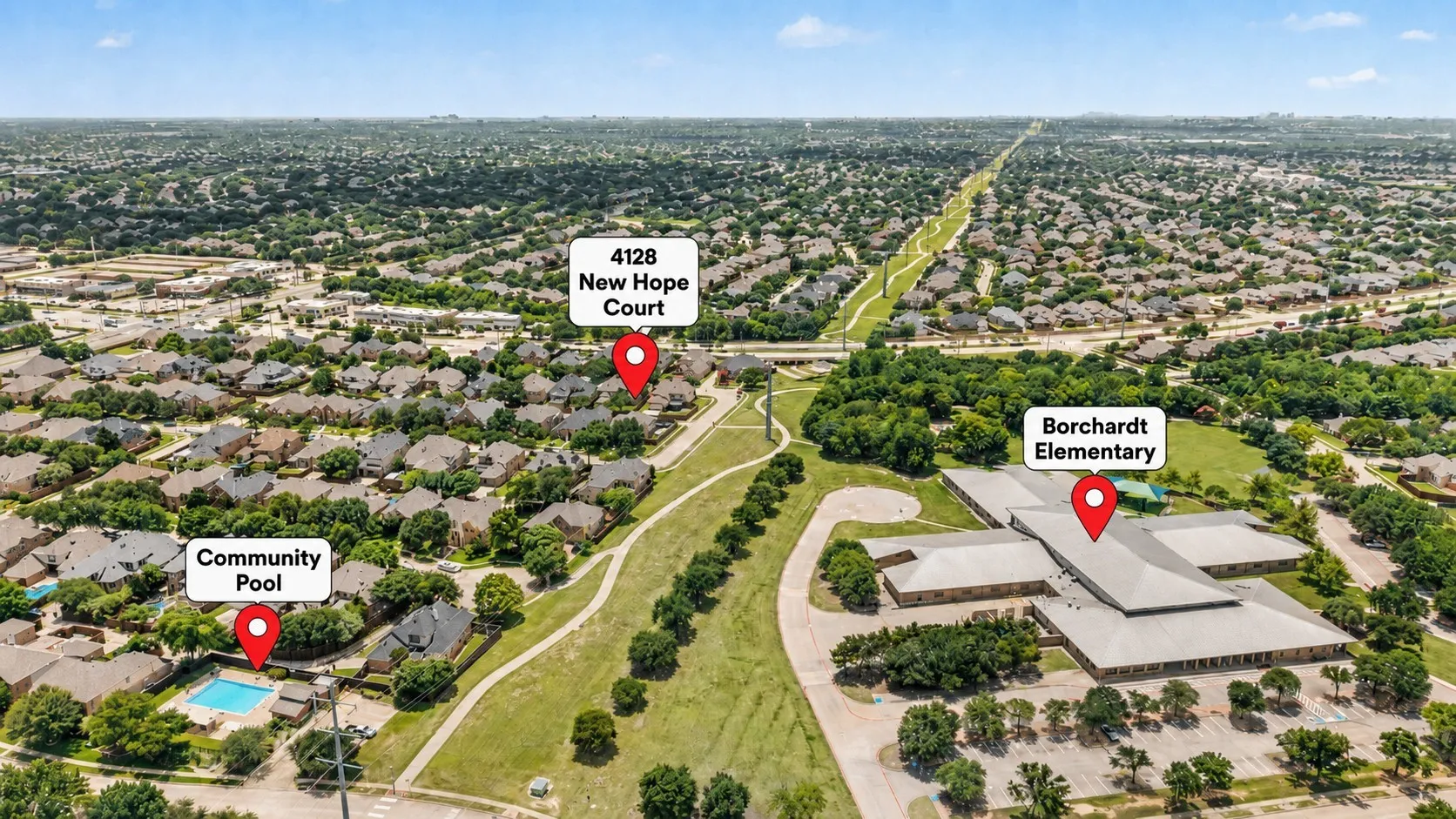Aerial overview of a residential neighborhood with ample green space