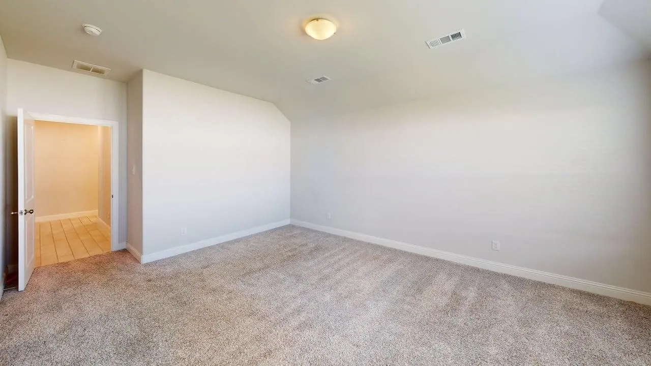 Carpeted room with white walls, a white ceiling, and a white baseboard trim