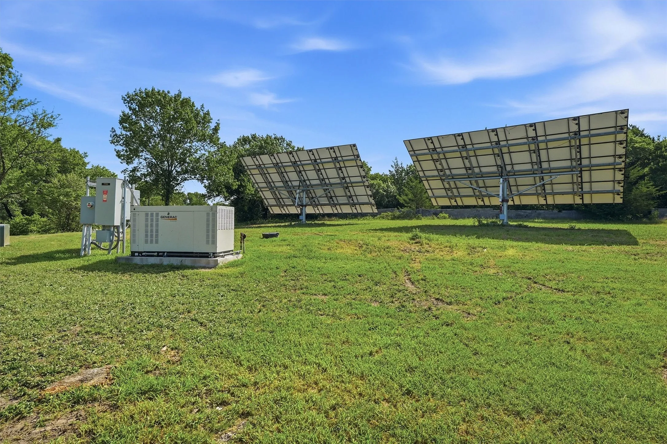 Ground-mounted solar panels and a generator system provide alternative power solutions