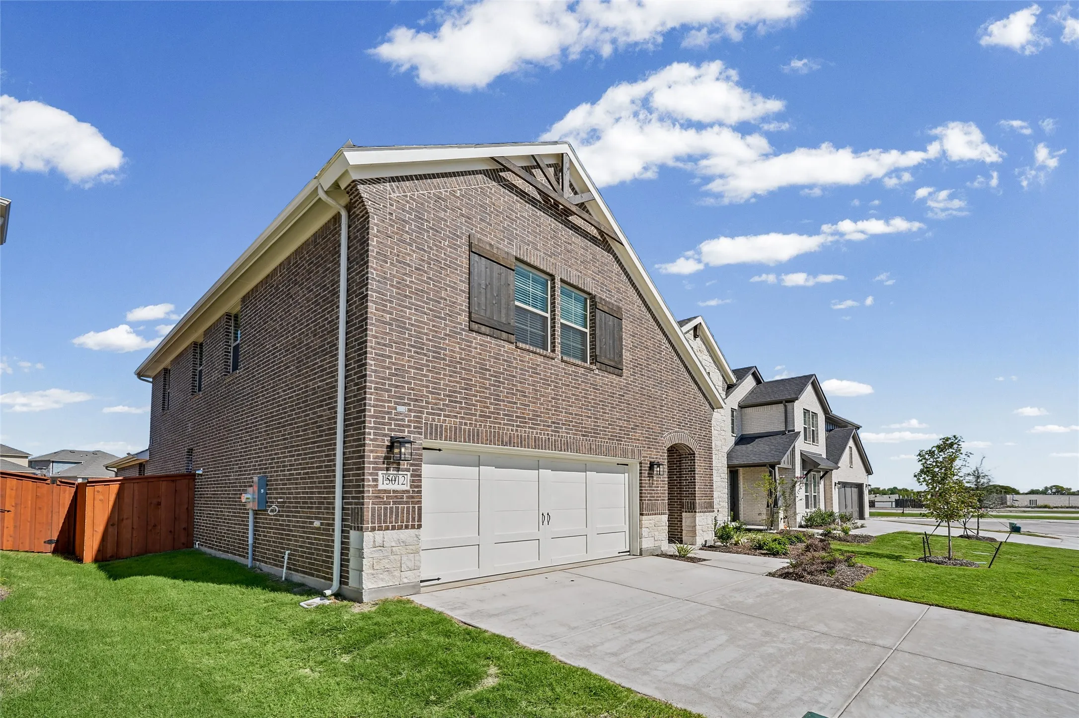 Brick and stone exterior with decorative gable accents
