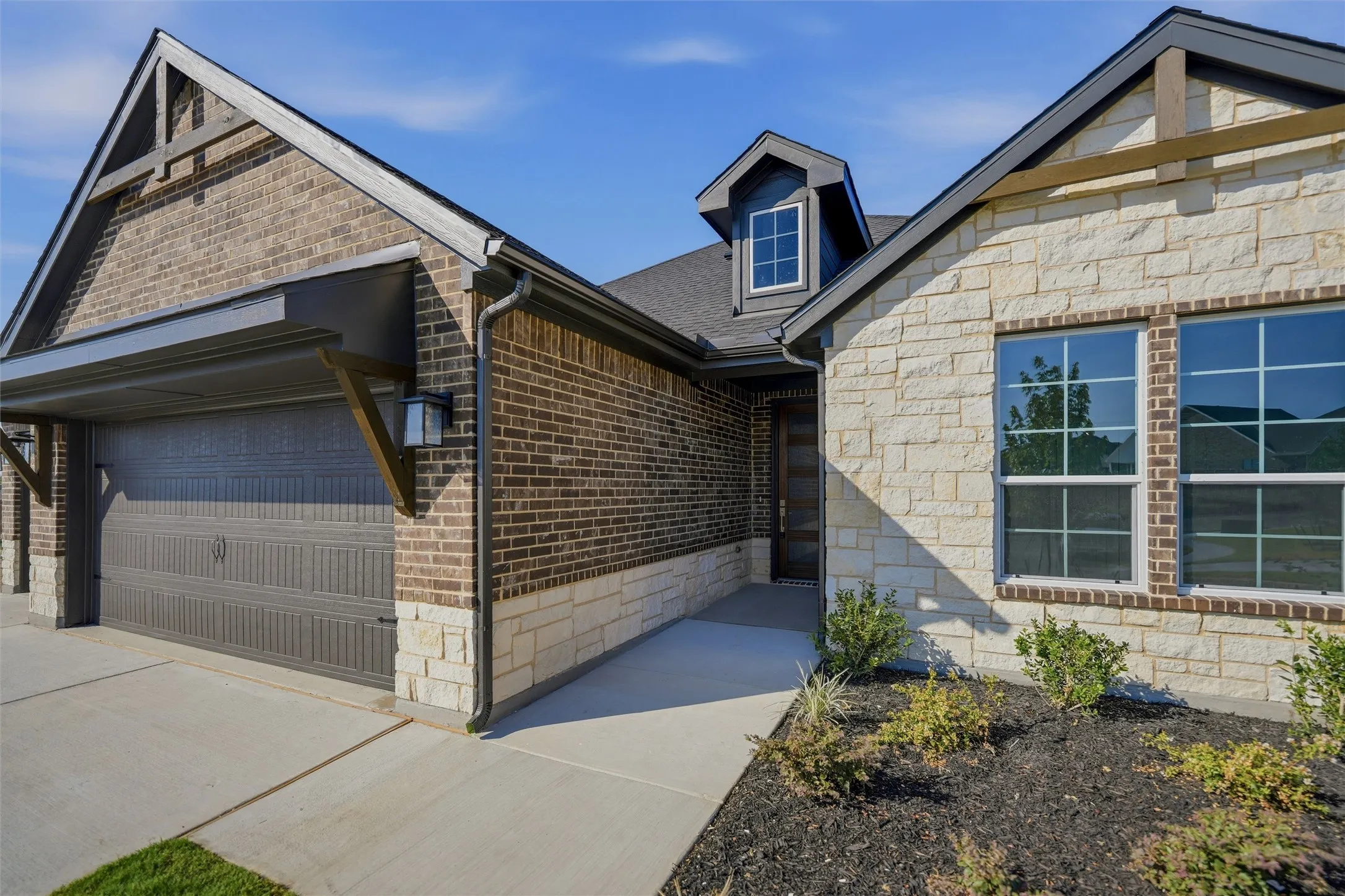Brick and stone exterior with architectural dormer