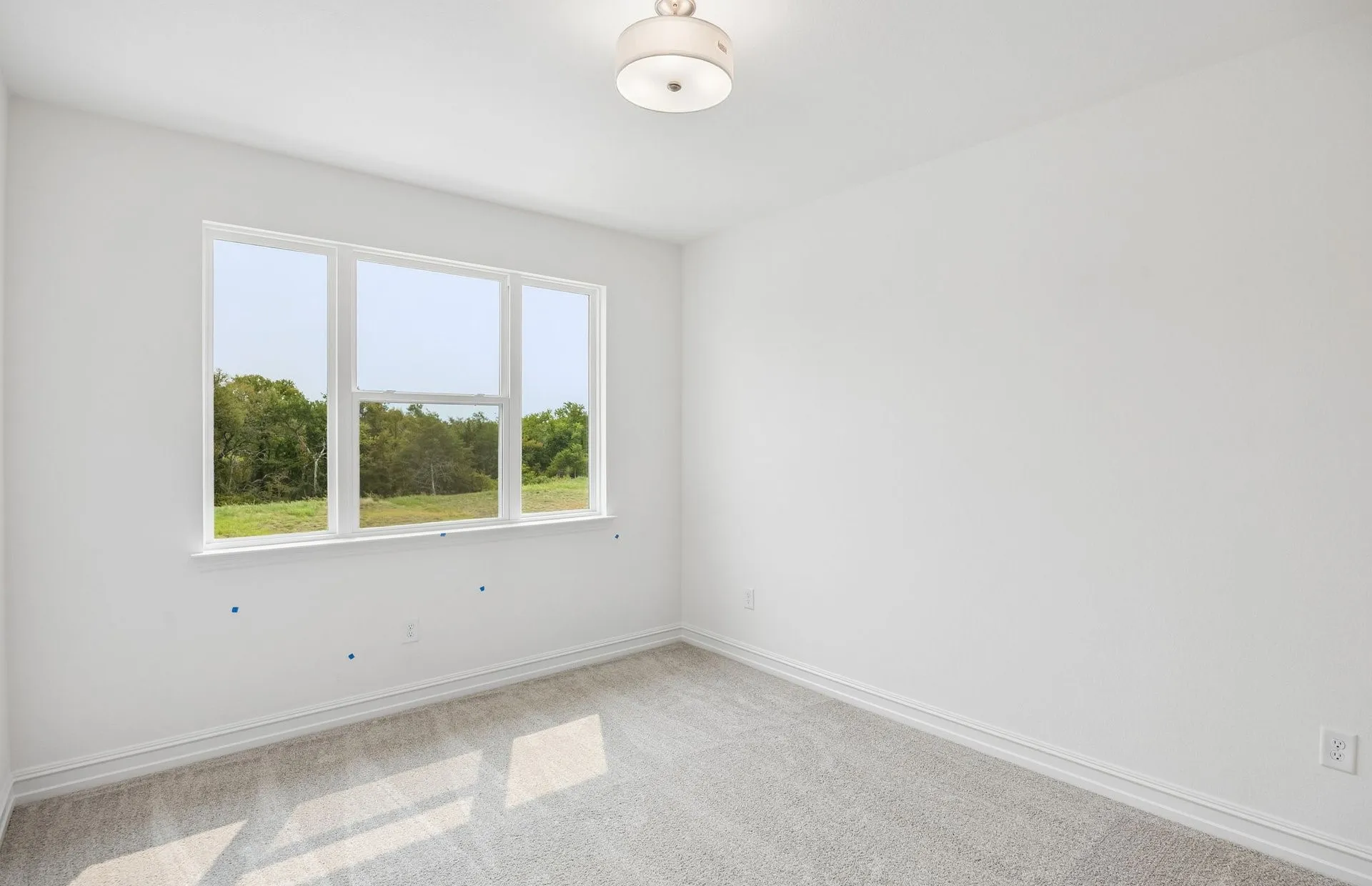 Secondary bedroom with large windows