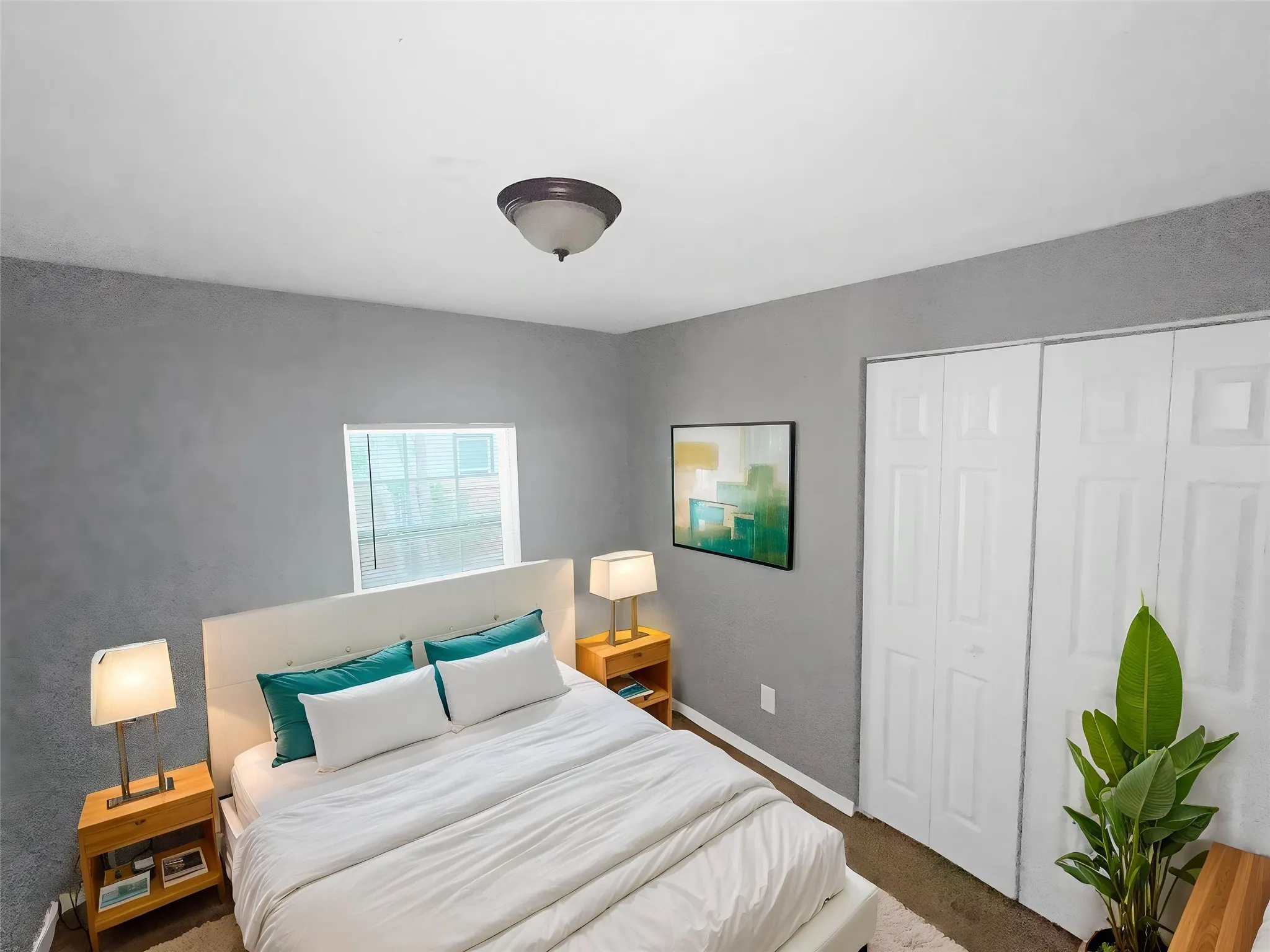 Virtually staged
Interior room featuring neutral wall color, overhead flush-mount lighting, and bi-fold closet doors