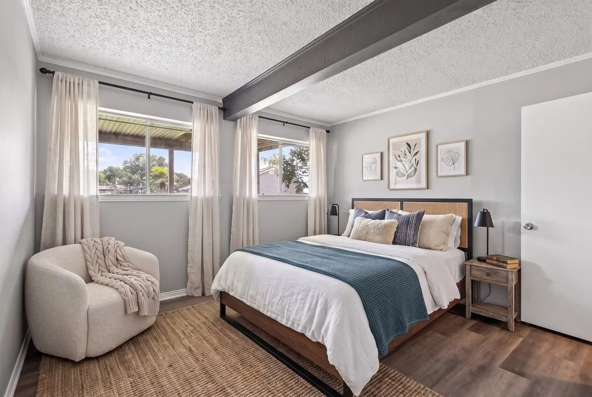 Virtually Staged - #3 Primary Bedroom with ensuite bathroom, lake view, located on lakeside elevation, downstairs walk-out basement which has a living room or game room with fireplace and access to lakeside yard.