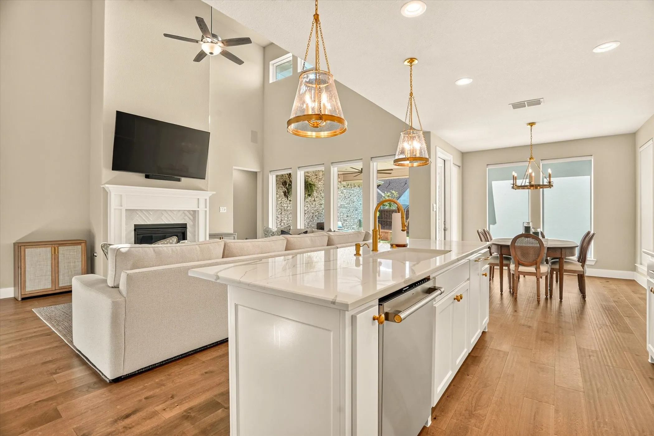 Spacious open-concept interior featuring wood-finish flooring throughout
