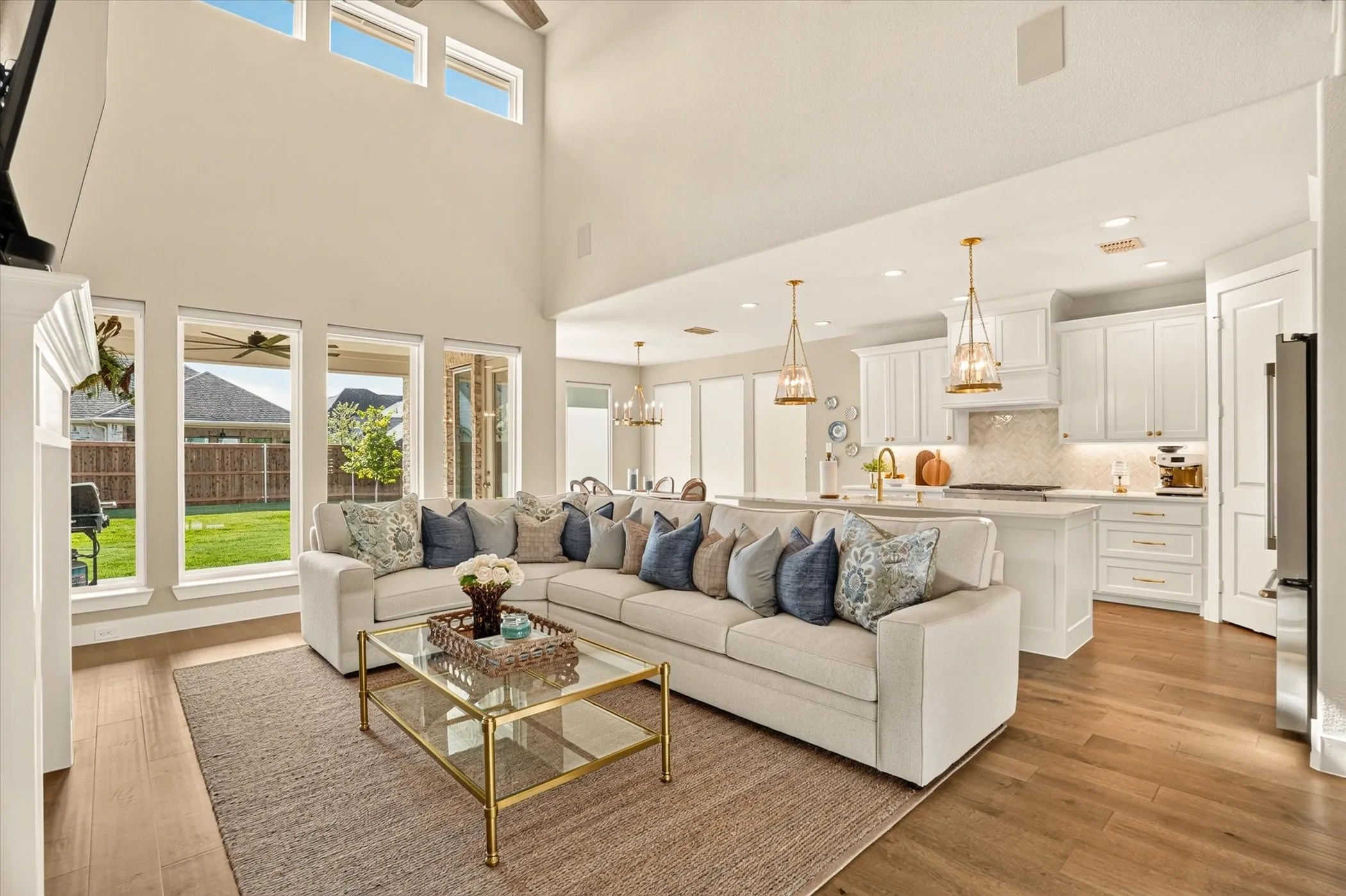 Two-story living area with wood-finish flooring and a high ceiling