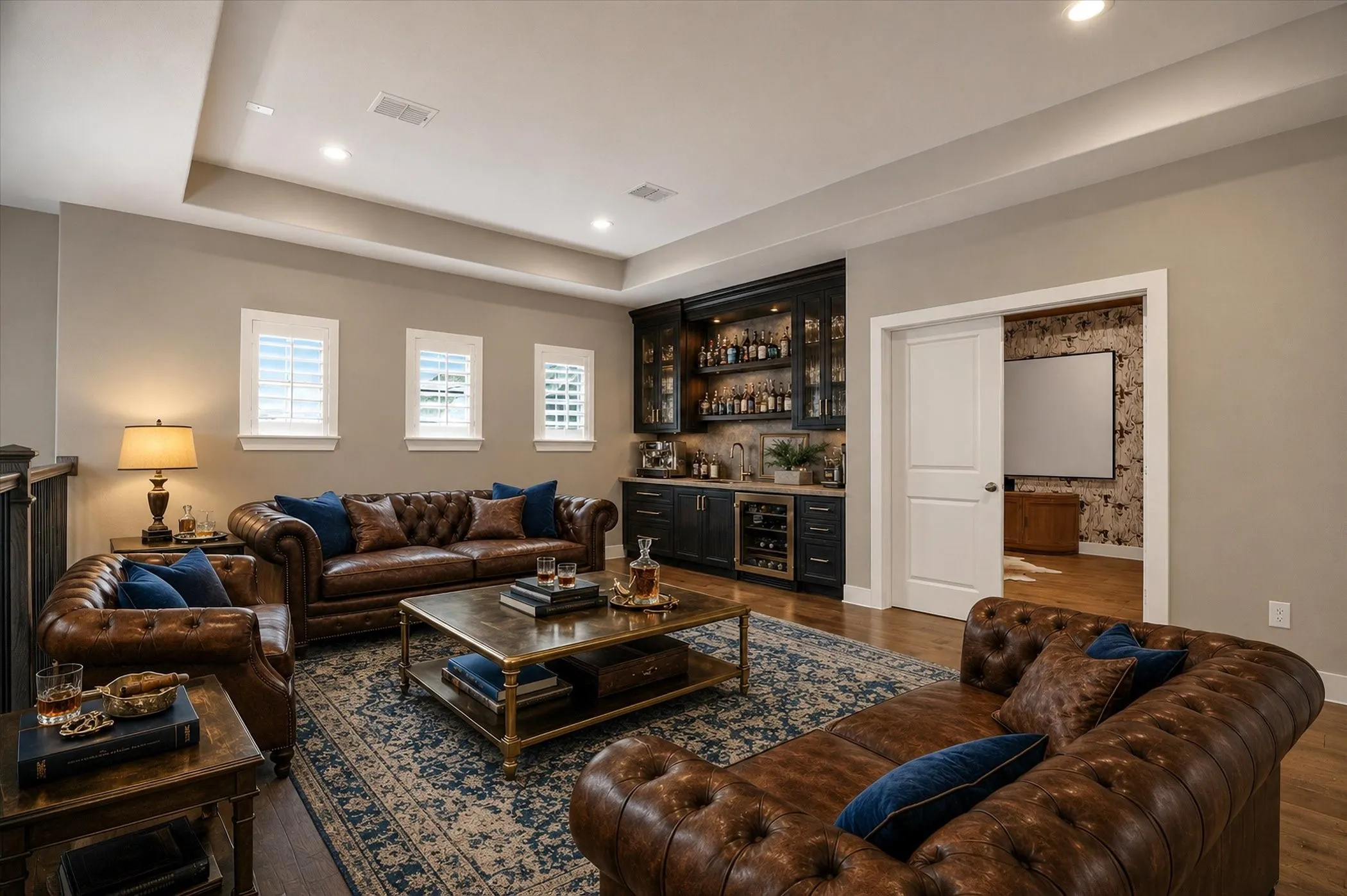 Living area featuring a tray ceiling with recessed lighting