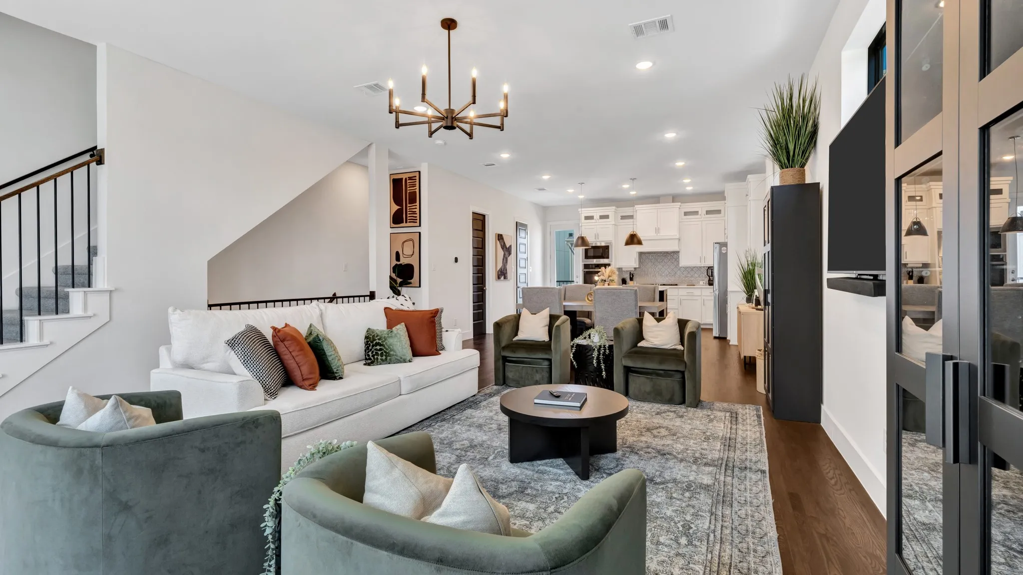 Second floor living area featuring a modern chandelier, and dark wood-finish flooring