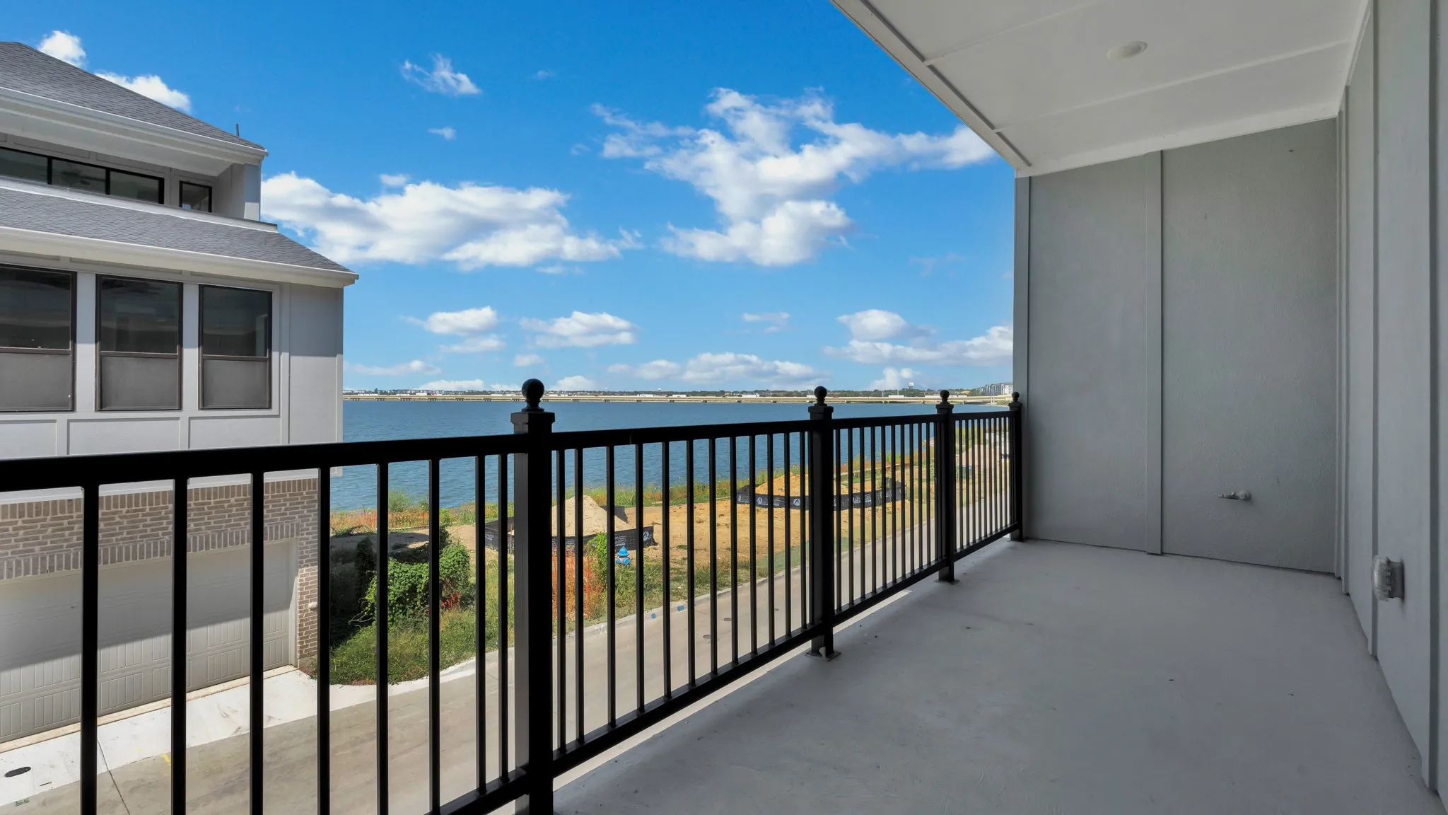 Outdoor balcony with a water backdrop