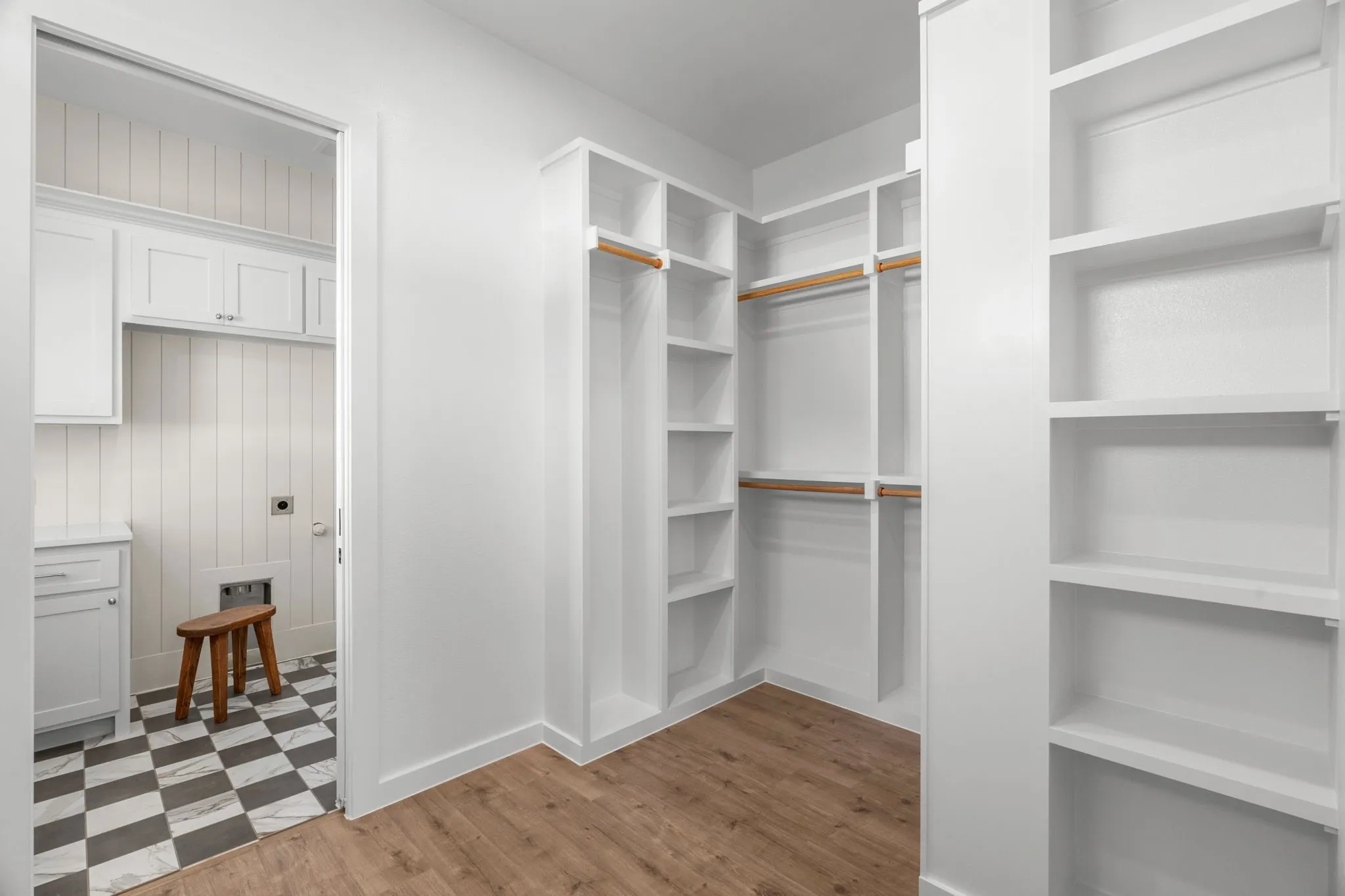Master closet connected to laundry room