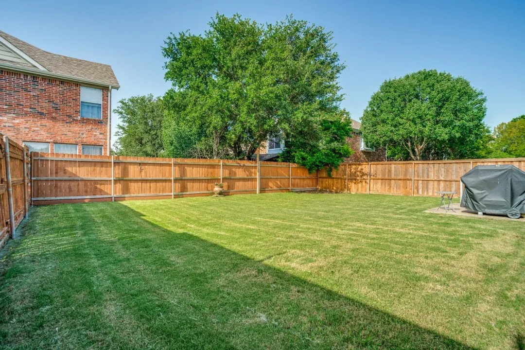 THE BACK YARD IS BEAUTIFULLY FENCED, MANY OPTIONS FOR LANDSCAPING, GARDENING AND ENTERTAINING SPACES
